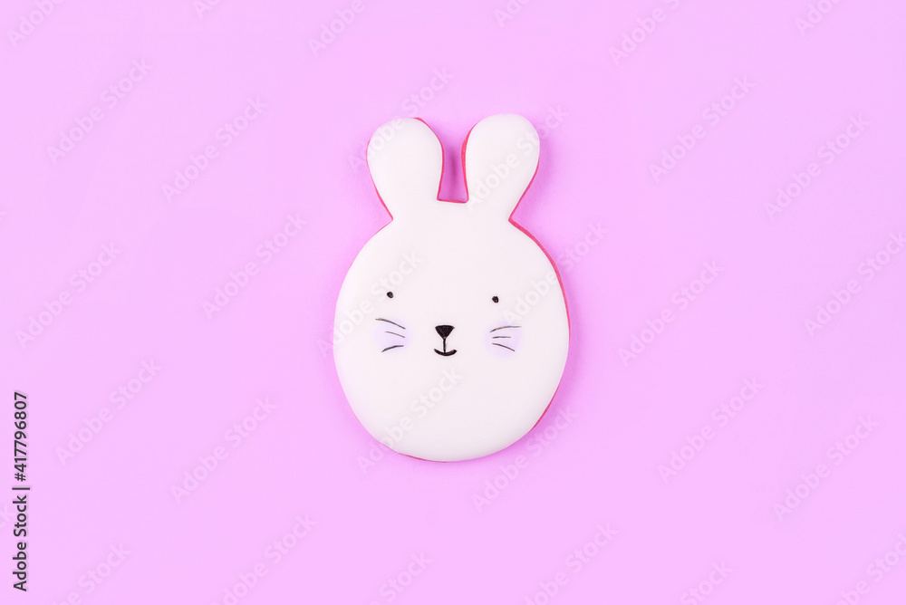 Fototapeta premium Easter bunny cookies on lilac background. Spring holiday.