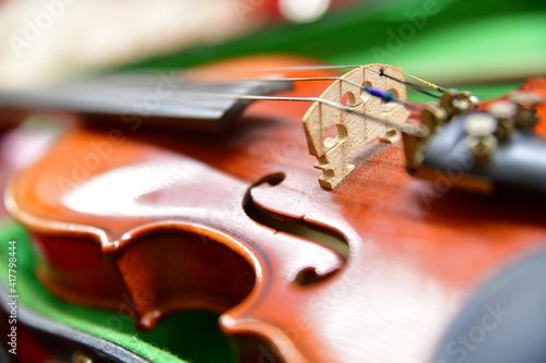 violin laid in a case on the sheet music
