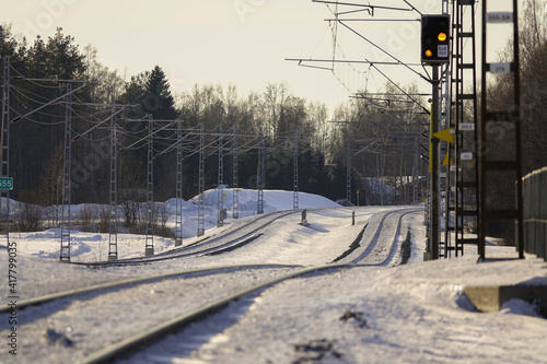 sloping electrical railroad in winter