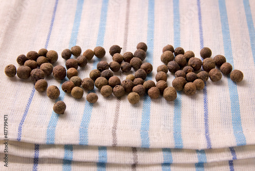 Canvas Print A bunch of allspice on a kitchen towel.