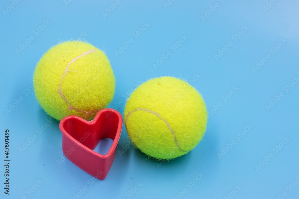Tennis ball is on blue background