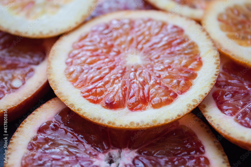 Grapefruit and orange half isolated on white background. Grapefruit half macro studio photo. Orange with clipping path Grapefruit and orange half isolated on white background. Grapefruit half macro studio photo. Orange with clipping path