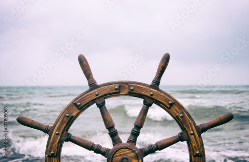 Steering wheel ship against the background of the sea
