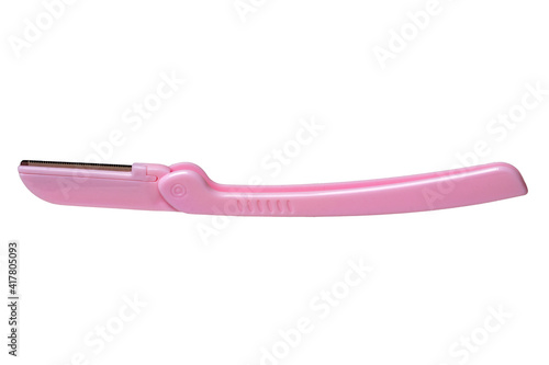 Cosmetic tools. Close-up of a pink eyebrow razor isolated on a white background. Beauty concept. Macro.