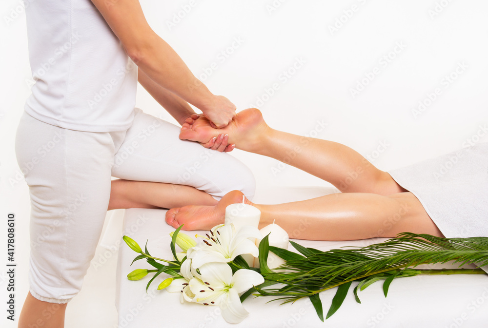 Massage of female feet. Foot massage in spa salon. Spa concept