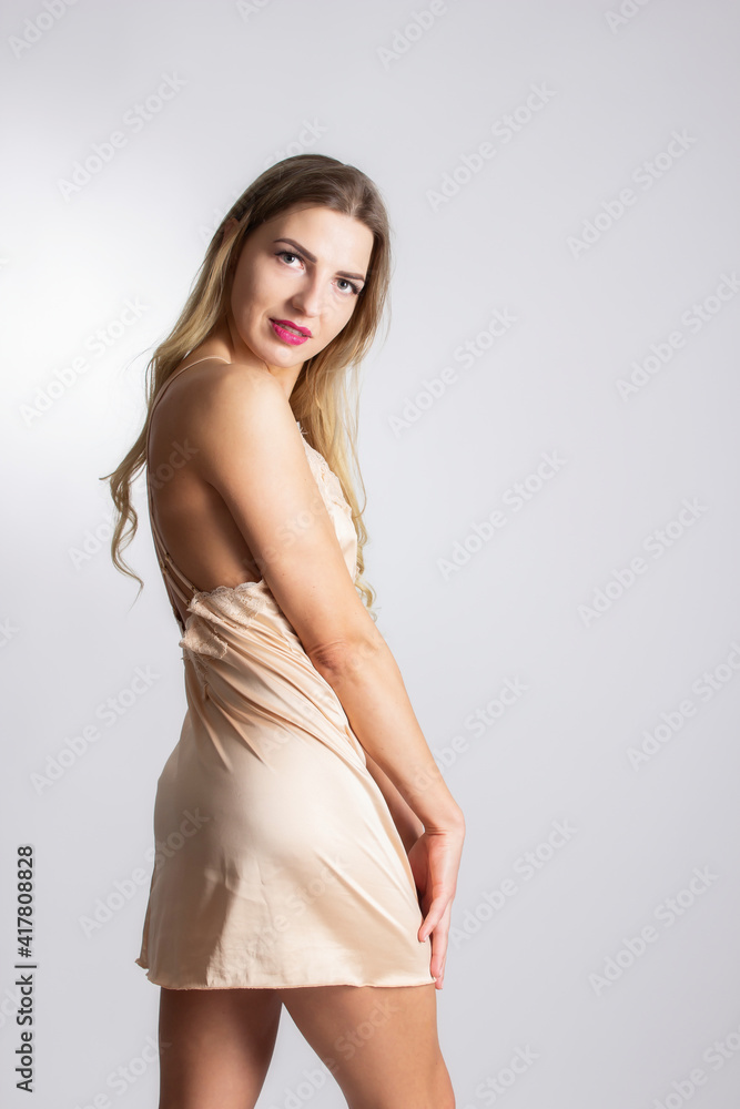 very beautiful young woman dressed only in nightwear
