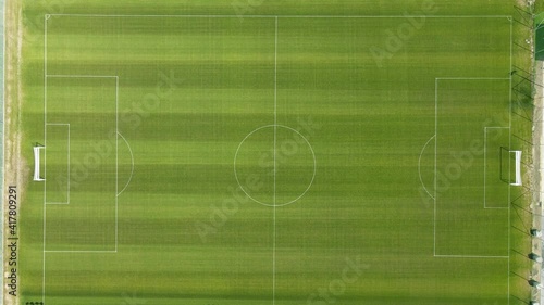 drone footage top down, big green empty soccer field