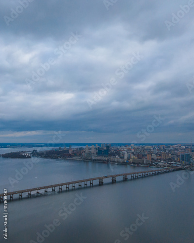 Dark clouds over the city in spring with drone © Denis Chubchenko