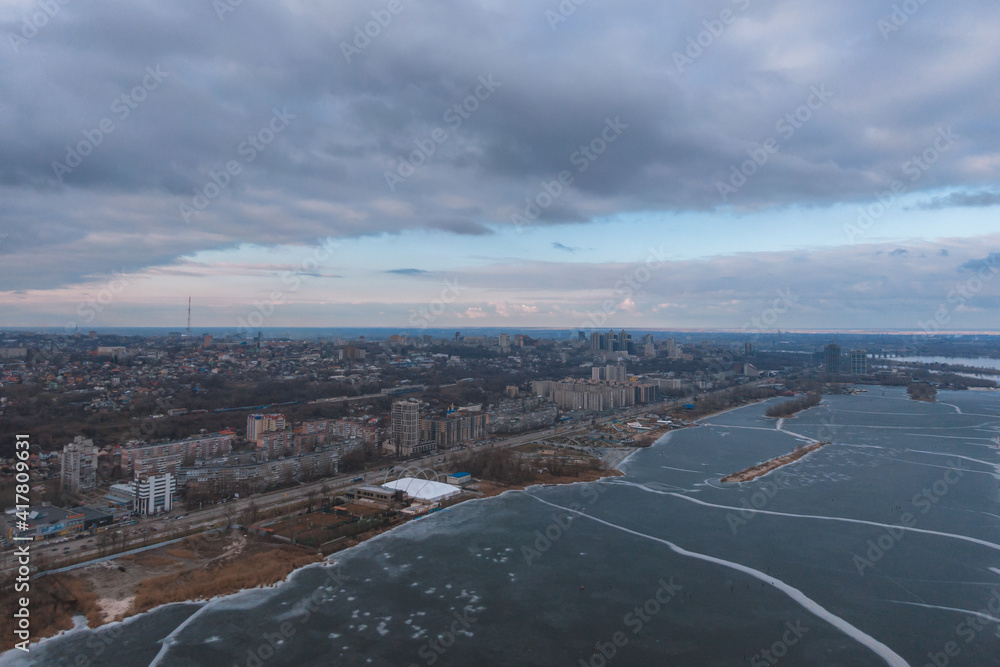 Dark clouds over the city in spring with drone