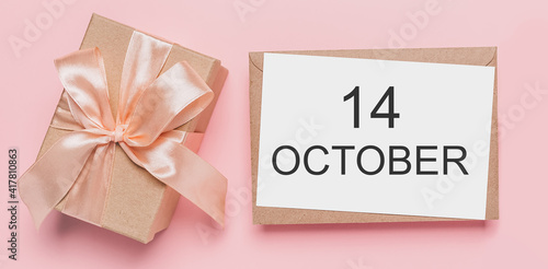 Gifts with note letter on isolated pink background, love and valentine concept with text 14 October