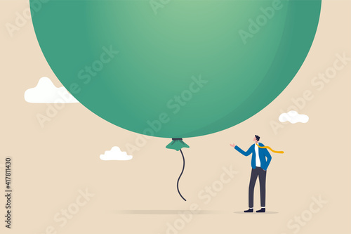 Stock market, crypto currency bitcoin bubble, risk of speculation investment, big debt balloon ready to burst concept, fearful businessman investor standing under huge big air balloon bubble.