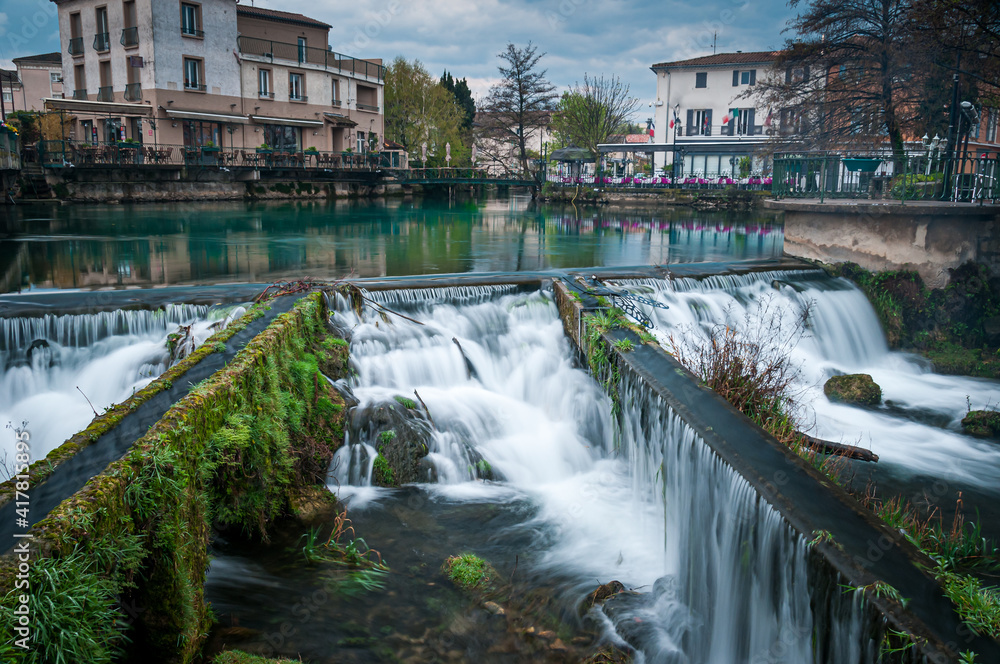 The Bassin L'Isle-sur-la-Sorgue, Vaucluse,.France, with its rivers and waterfalls and bars and restaurants in the background , Provence france .