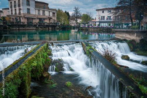The Bassin L'Isle-sur-la-Sorgue, Vaucluse,.France, with its rivers and waterfalls and bars and restaurants in the background , Provence france .