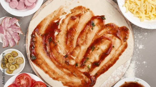 Stop motion animation pizza. Making pizza with ingredients, close-up top view.