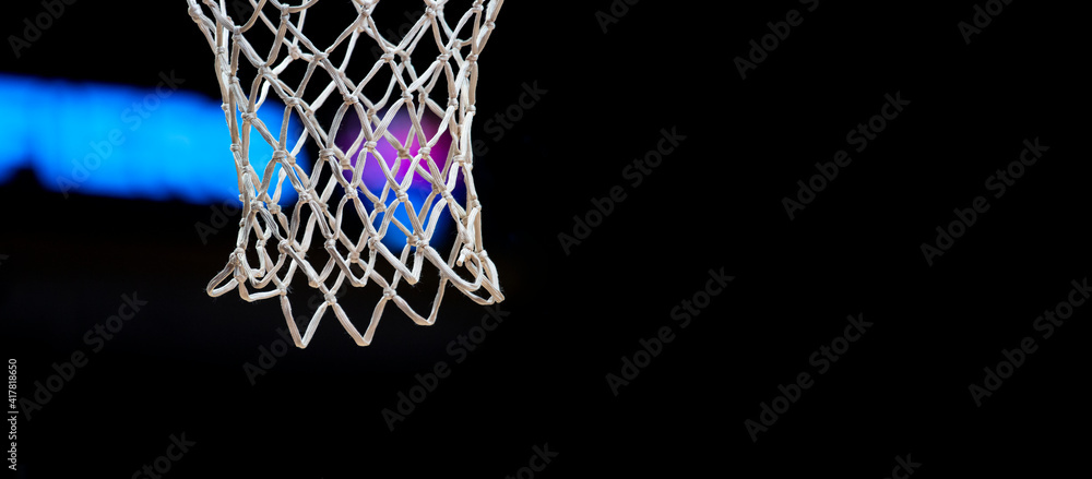 Empty Swooshing Basketball Net Close Up with Dark Background. Sports background for product display, banner, or mockup. Empty Swooshing Basketball Net Close Up with Dark Background. Sports background for product display, banner, or mockup.