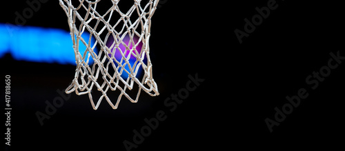 Empty Swooshing Basketball Net Close Up with Dark Background. Sports background for product display, banner, or mockup. © Augustas Cetkauskas