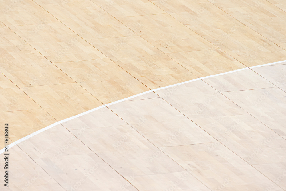Wooden floor volleyball, basketball, badminton, futsal, handball court with light effect Wooden floor of sports hall with marking lines line on wooden floor indoor, gym court