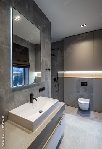 Modern interior in grey tones of bathroom in luxury apartment.