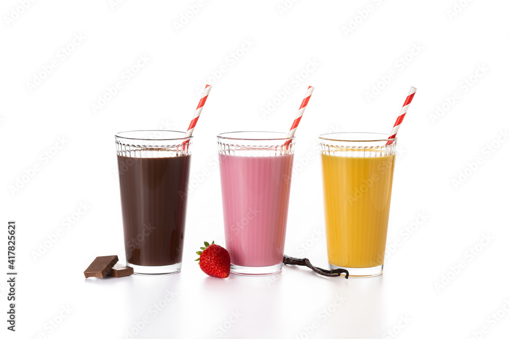 Chocolate, strawberry and vanilla milkshakes isolated on white background Chocolate, strawberry and vanilla milkshakes isolated on white background