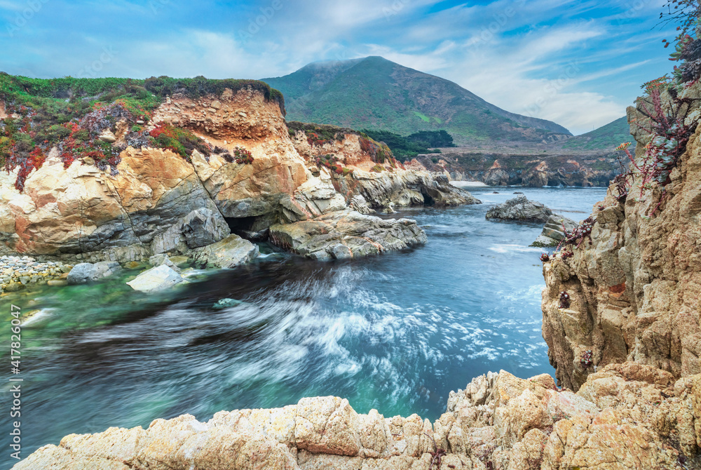Beautiful view of a small rocky cove in the Pacific Ocean, colorful landscape, sea coast along the number one road in California
