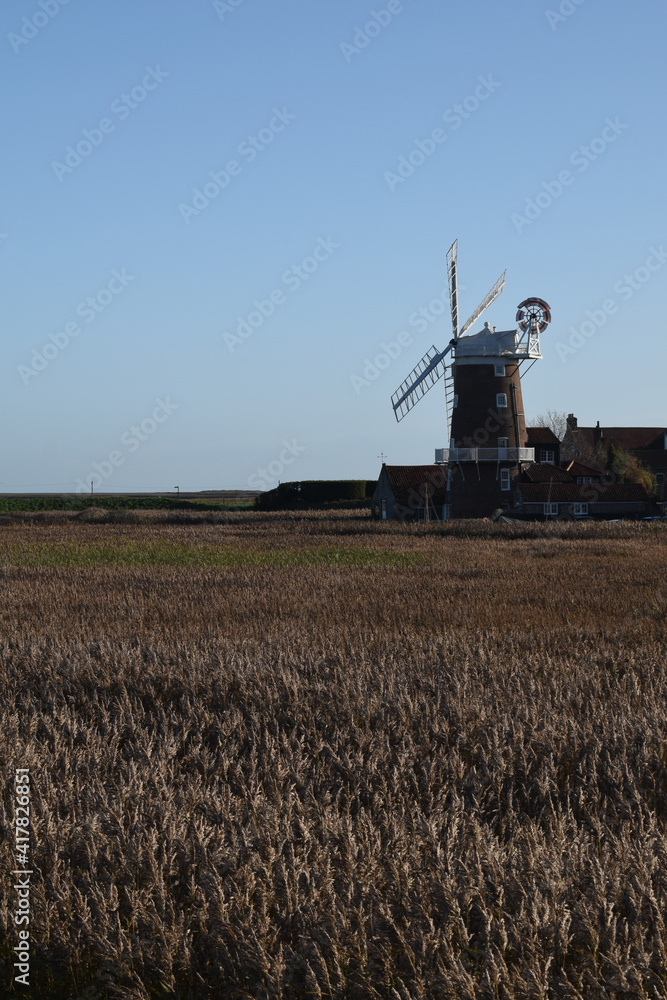 Fototapeta premium Cley Mill on a bright, sunny day. North Norfolk, UK