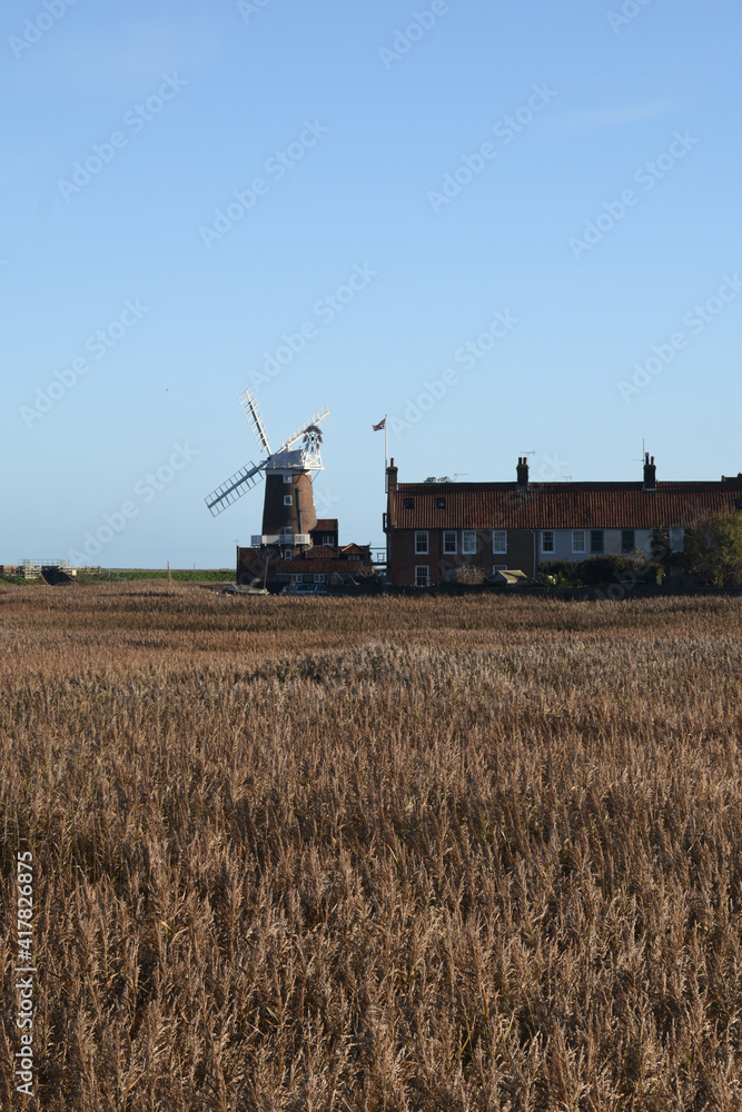 Naklejka premium Cley Mill on a bright, sunny day. North Norfolk, UK