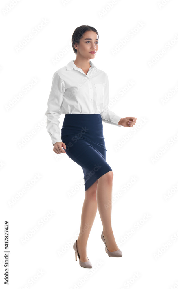 Businesswoman imitating stepping up on stairs against white background. Career ladder concept Businesswoman imitating stepping up on stairs against white background. Career ladder concept