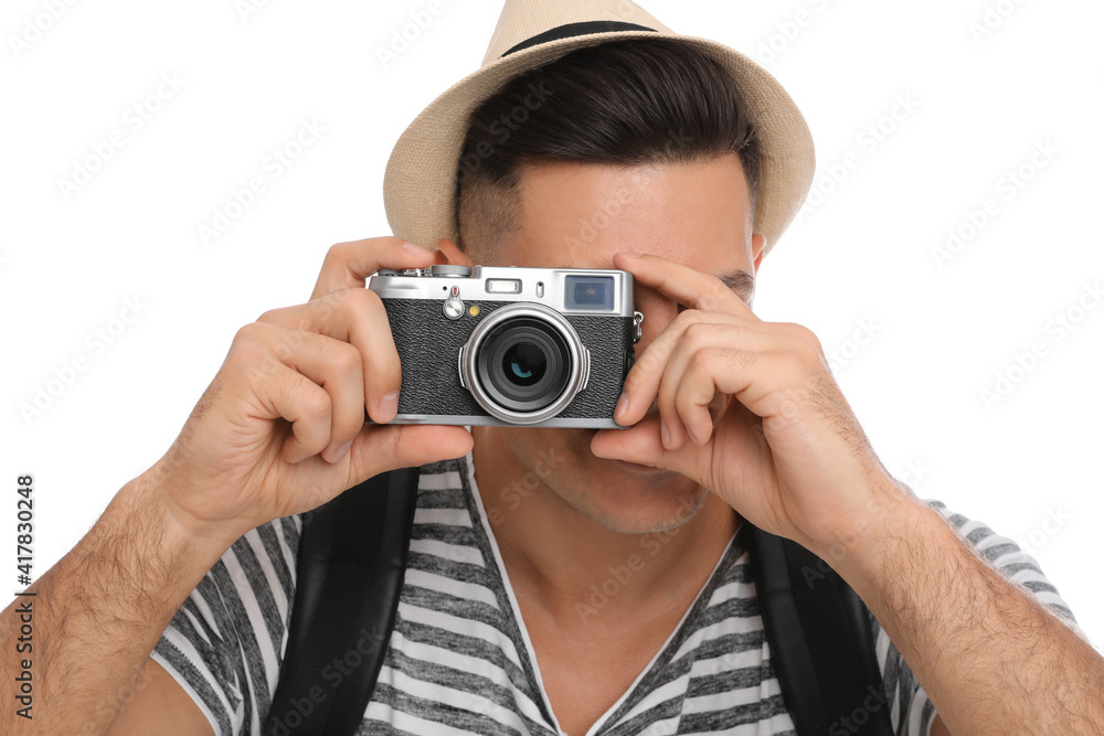 Man with straw hat taking picture on white background, closeup. Summer travel Man with straw hat taking picture on white background, closeup. Summer travel