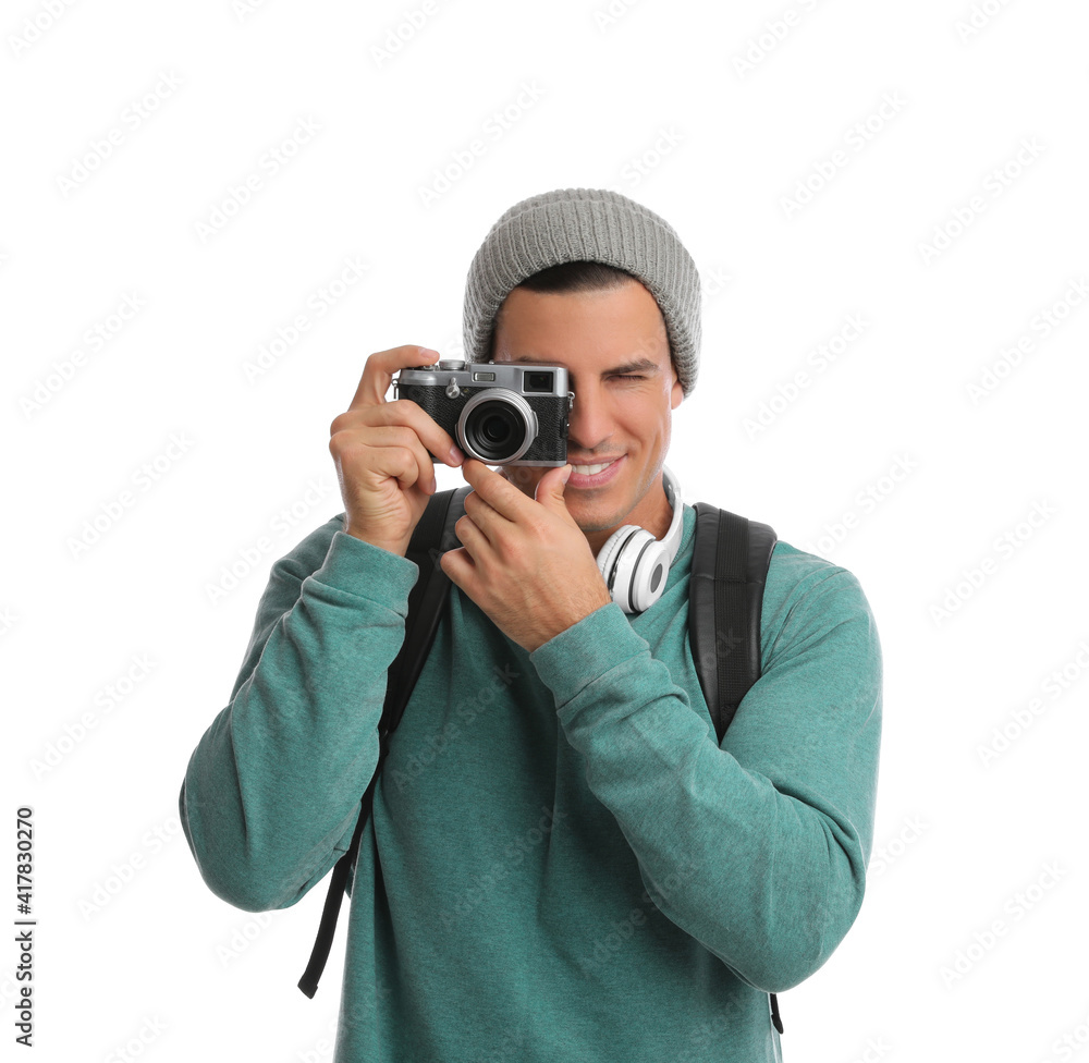 Man with backpack taking picture on white background. Autumn travel Man with backpack taking picture on white background. Autumn travel