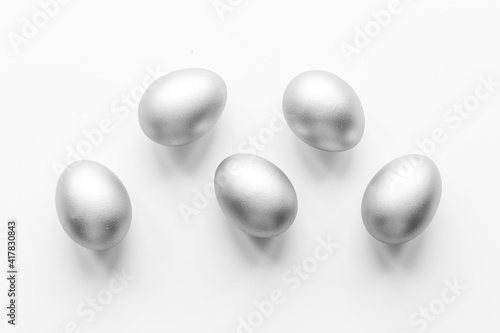 Silver eggs isolated on white background. Easter decoration background. Top view