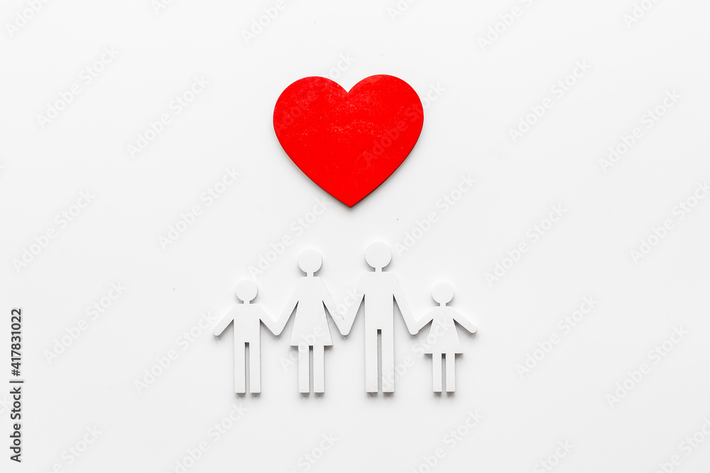 Family wooden figure and heart shape. Life insurance concept Family wooden figure and heart shape. Life insurance concept