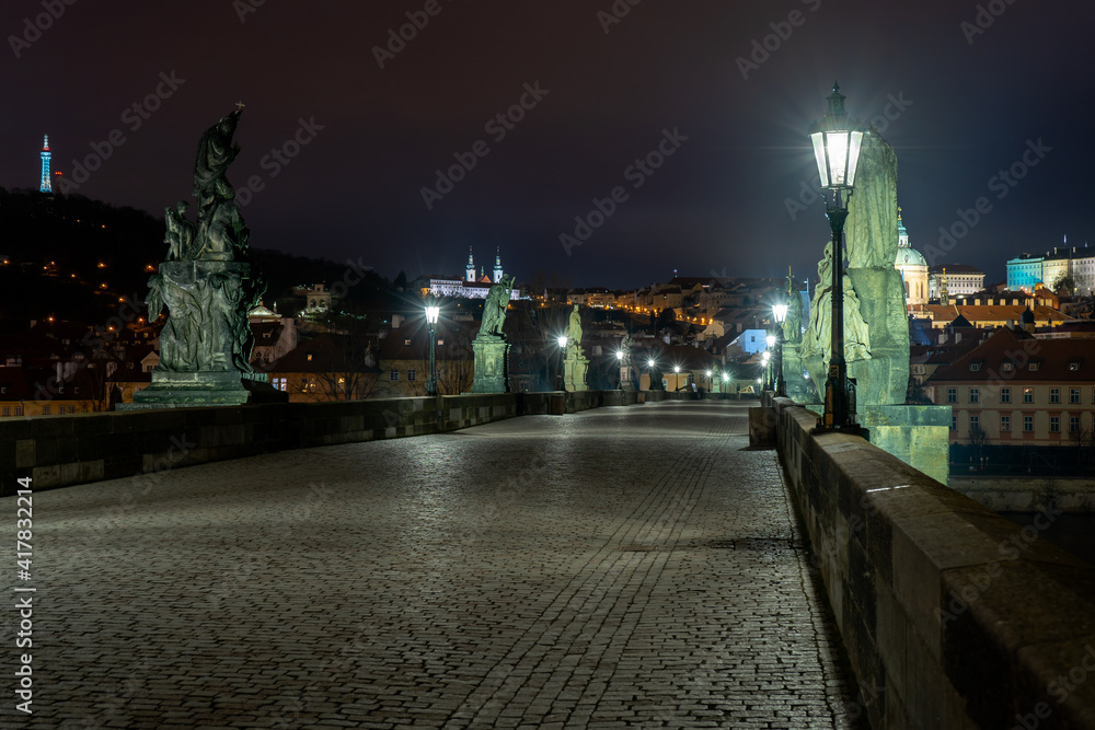  Charles Bridge and lighted lanterns on it and statues