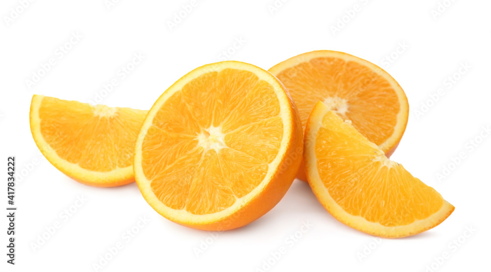 Cut fresh ripe oranges on white background