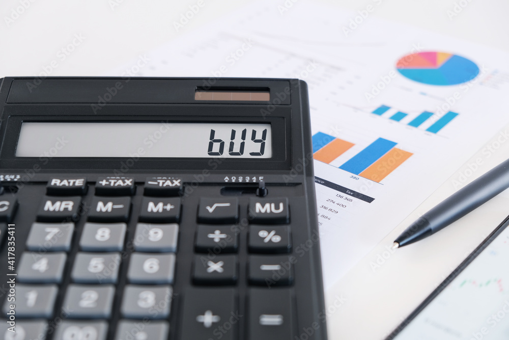 Calculator Showing Buy on Screen. Financial Advisor Concept. Calculator Showing Buy on Screen. Financial Advisor Concept.