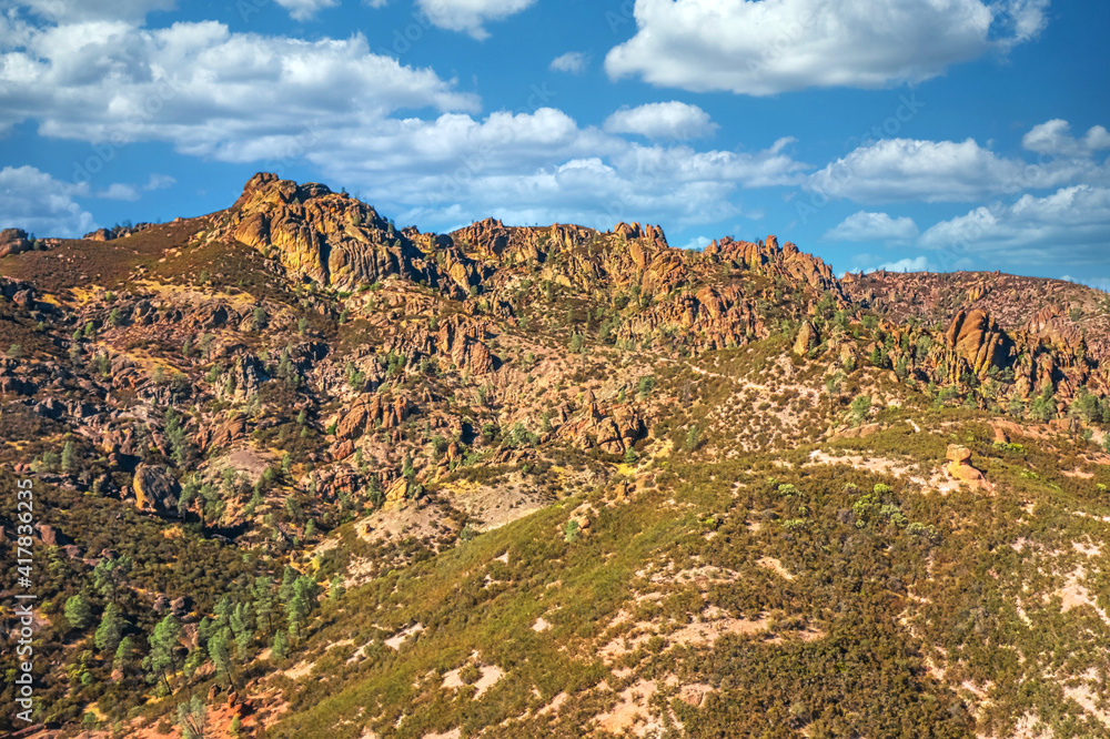 Aerial view of rock formations in Pinnacles National Park in California, ruined remains of an extinct volcano on the San Andreas Fault. Beautiful landscapes, cozy hiking trails for tourists and Aerial view of rock formations in Pinnacles National Park in California, ruined remains of an extinct volcano on the San Andreas Fault. Beautiful landscapes, cozy hiking trails for tourists and