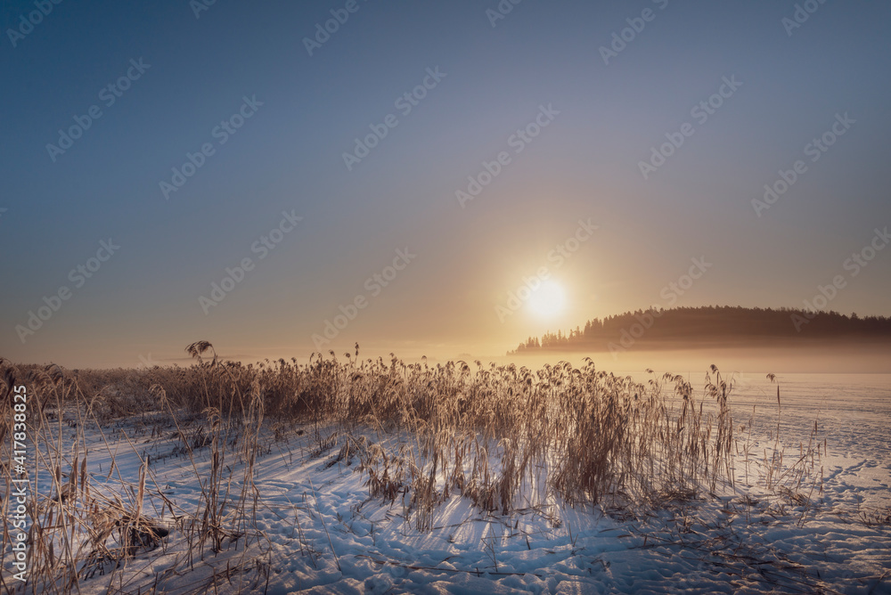 Winter landscape in Finland .Sunrise in the morning Winter landscape in Finland .Sunrise in the morning