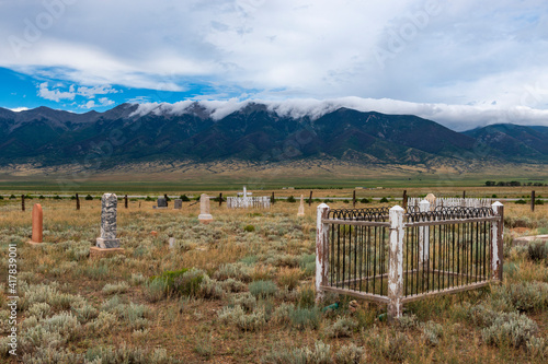 View of a cemetery with mountains on the background  near Villa Grove  in the State of Colorado  USA