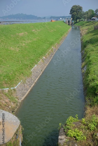 Klaten, Indonesia, March 3, 2021. The flow of heavy river water that comes from the Rowo Jombor reservoir for irrigation canals. photo