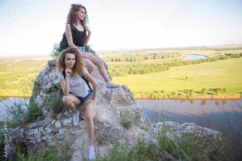Two girls hiking in the mountains. Nature and healthy lifestyle