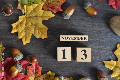 November 13, Cover Date design with Calendar cube decorate with maple leaf and Acorn Oak seed for your business.