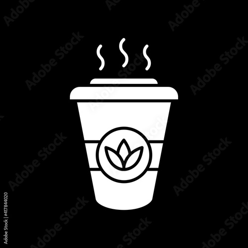 Hot herbal tea to go dark mode glyph icon. Drink take out. Steaming beverage for take away. Portable cup with leaf tea. White silhouette symbol on black space. Vector isolated illustration
