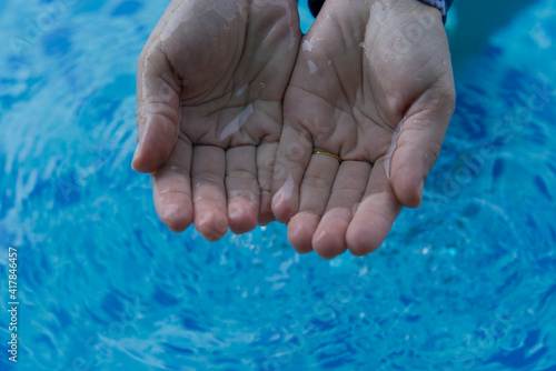 woman hand soaked in water