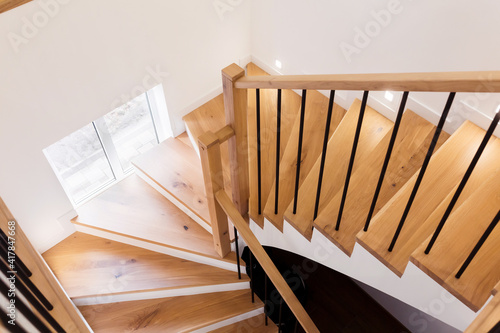 Fotografi Wood staircase inside contemporary white modern house.