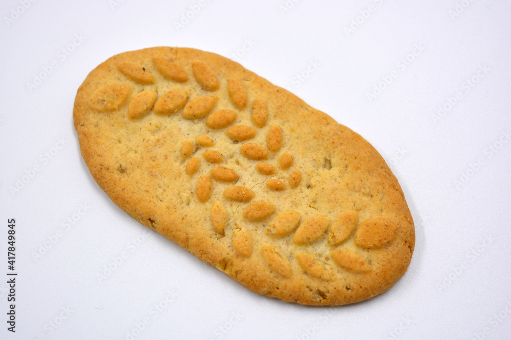 Useful satisfying slim cookies with nuts and bran located on a white background. Useful satisfying slim cookies with nuts and bran located on a white background.