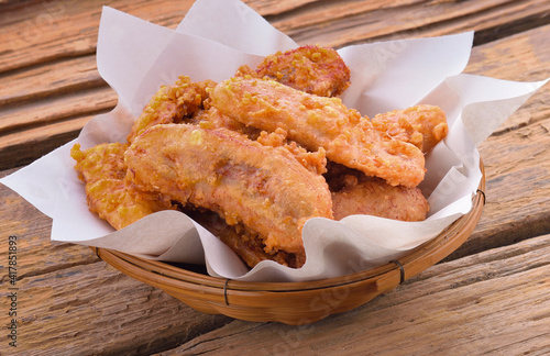 Fried bananas on wooden background photo