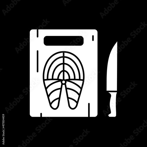 Fish on cutting board dark mode glyph icon. Cook salmon. Seafood preparation. Recipe ingredient. Fresh tuna steak. White silhouette symbol on black space. Vector isolated illustration