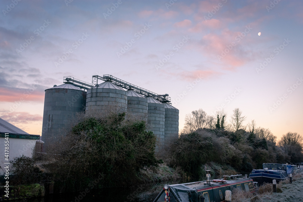 Big Metal Water Tower at Irish Canal with Barge Boat Big Metal Water Tower at Irish Canal with Barge Boat