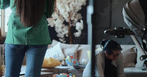 Wallpaper Mural Girl getting ready for live broadcast while grandma keeps grandson in the same room, home studios for live video streaming. Living room, family business Torontodigital.ca