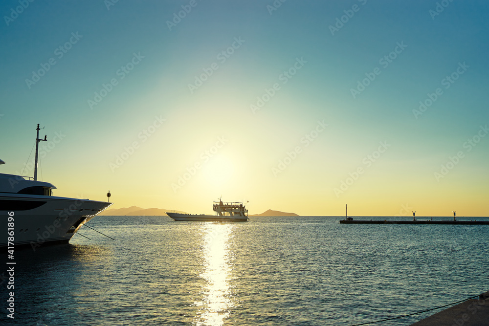 Travel by Greece. Beautiful sunset landscape with big ferry and sea wharf.Travel by Greece. Beautiful sunset landscape with big ferry and sea wharf.