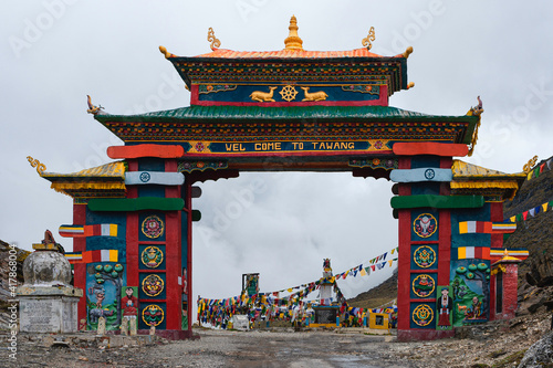 Colorful gateway with Buddhist prayer flags in Himalayas. Tawang, India.